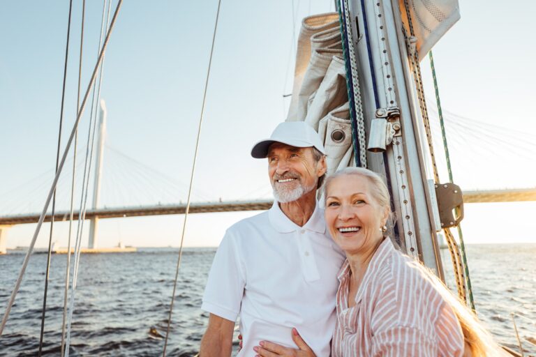 Senior couple relaxing on boat at beach vacation